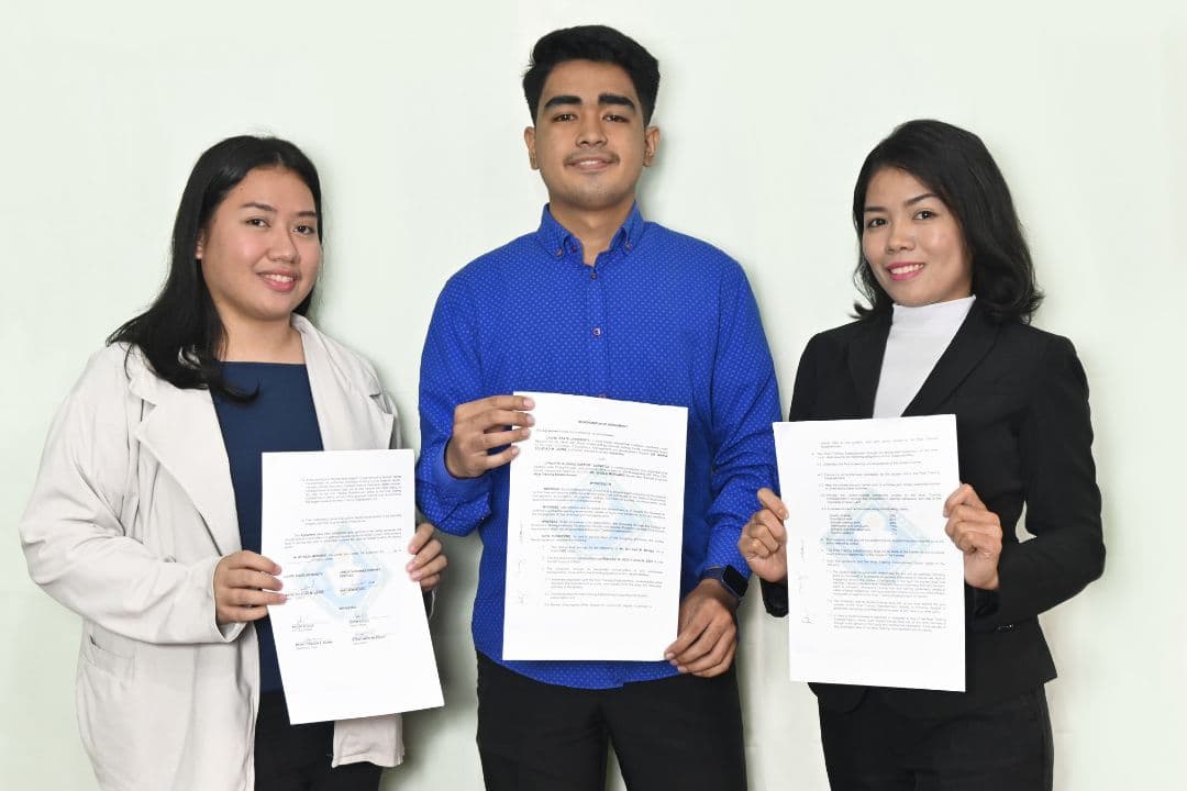 UPworth interns with their signed internship agreements